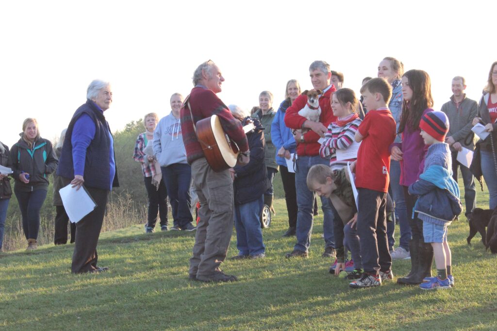 Easter dawn celebration on Nibley Knoll with Peter Marsh playing the guitar
